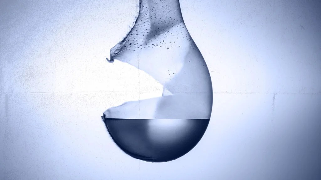 artistic image of a balloon bursting, releasing pressure