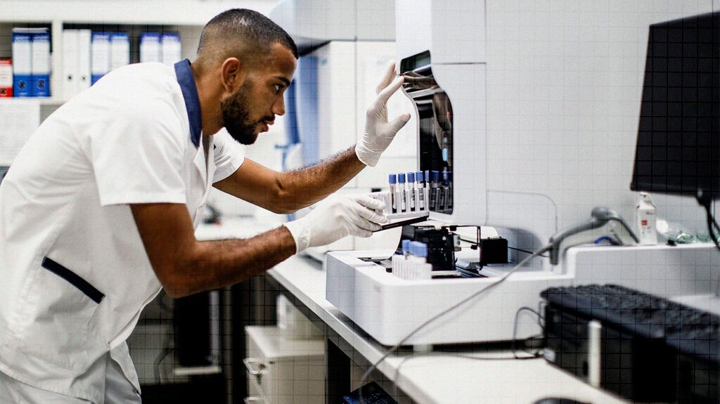 A scientist analyzing samples in a laboratory to help diagnose LEMS or MG.