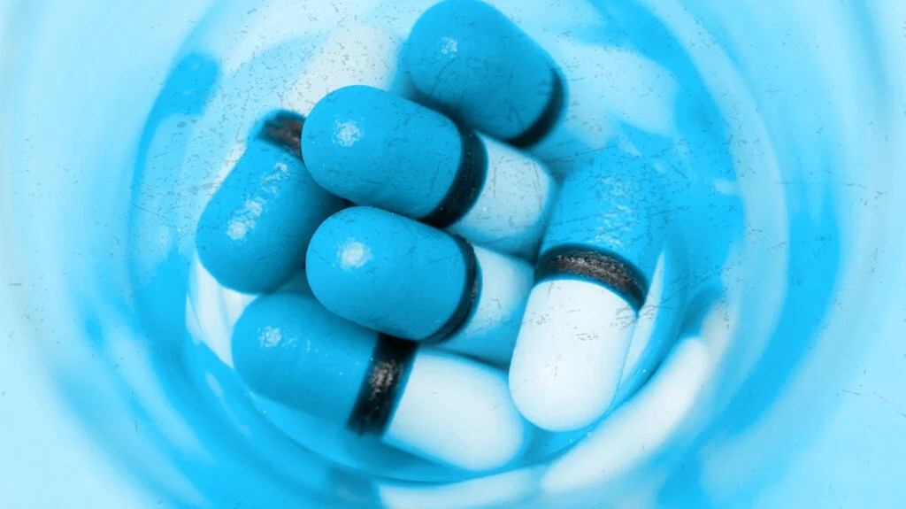 Image of light blue medication capsules which may be psychotropic